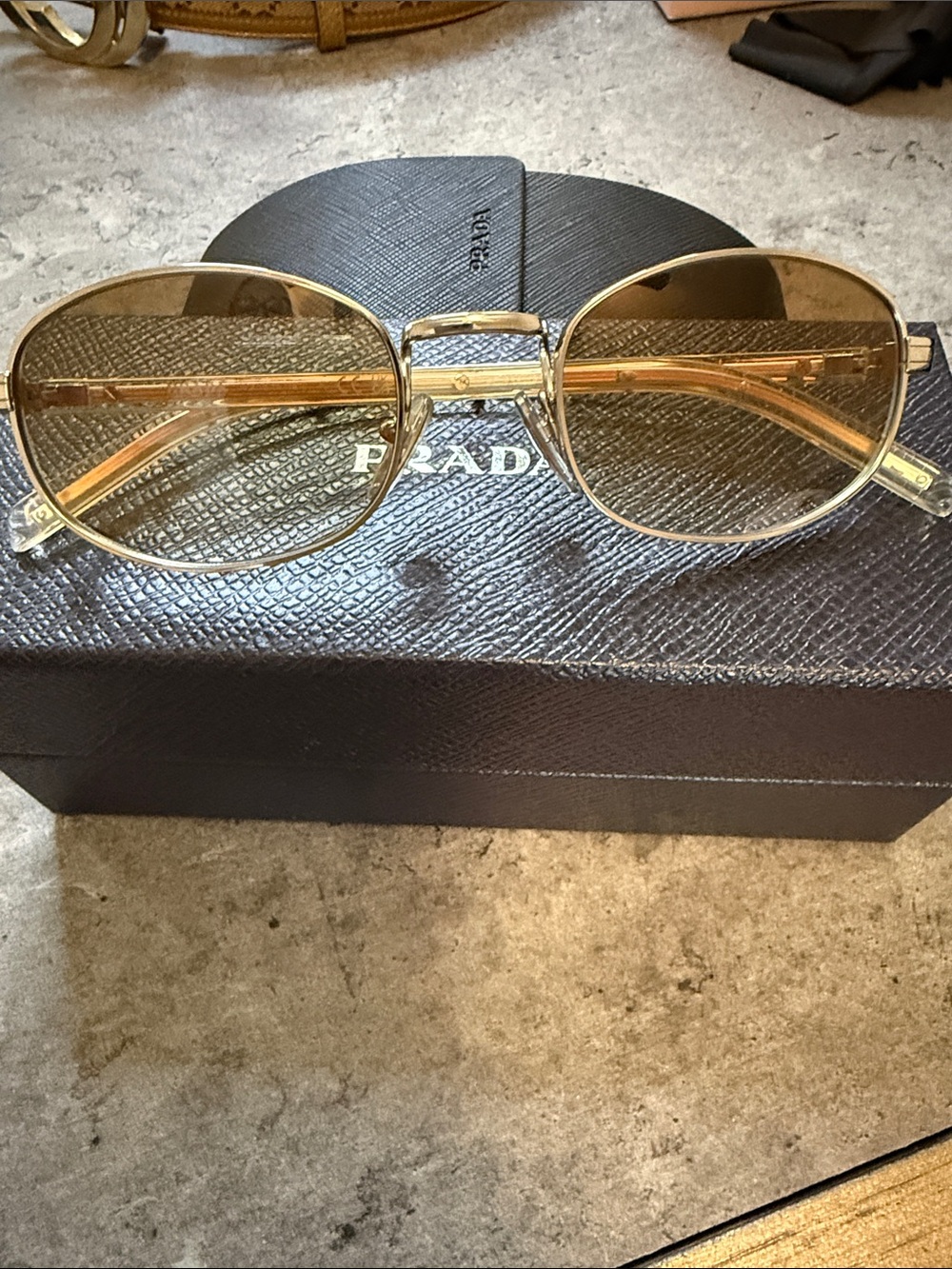 Prada Metal Oval Sunglasses with Amber Tint